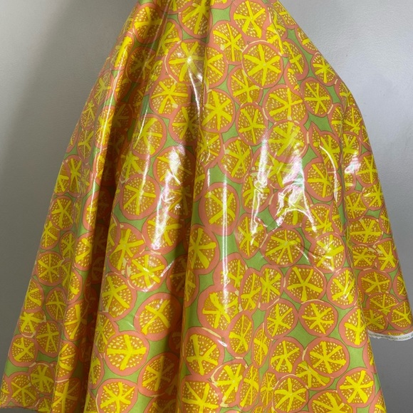 100% COTTON BASE FABRIC WITH WATERPROOFING PLASTIC OVERTOP IN A VIBRANT CITRUS - Picture 4 of 6